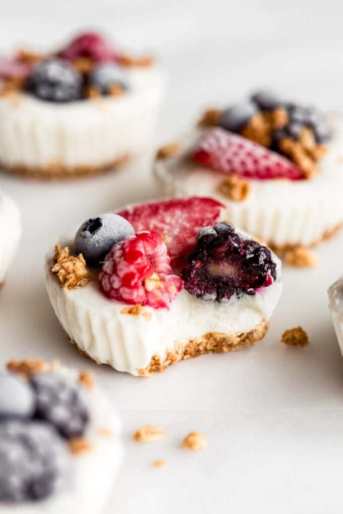 a frozen yogurt granola cup with a bite taken out of it